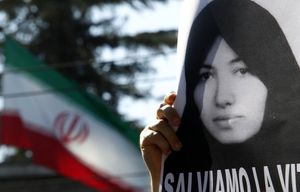 561420_a-demonstrator-holds-a-picture-of-sakineh-mohammadi-ashtiani-in-front-of-the-iranian-embassy-in-rome
